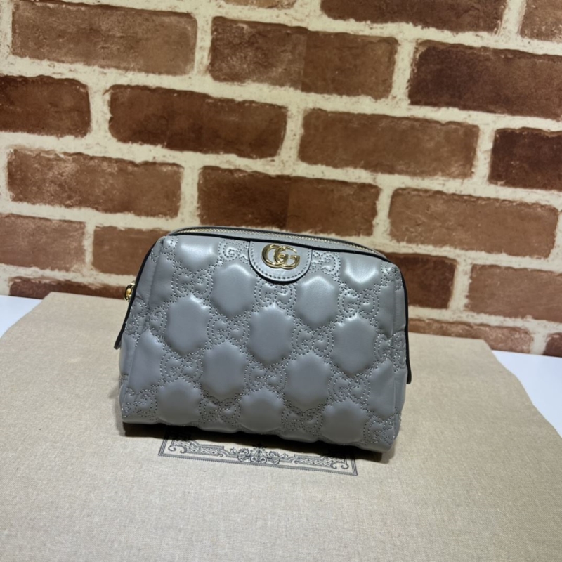 G*u*i clutch bags
